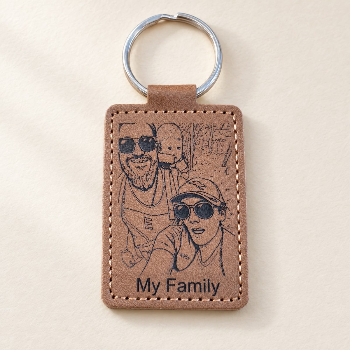 Brown leatherette keyring with an engraved family portrait and the words My Family.